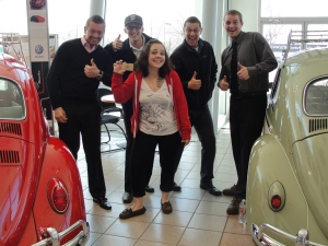 Nicole Kennebeck (center) celebrates her Whole Foods $300 gift card win with some of the Larry H. Miller Volkswagen Lakewood sales staff. Left to right: Josh Sahr, Nic Long, Eddie Neyman and Thomas Furlong.